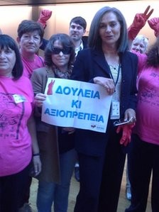 Posing with MEP Sofia Sakorafa with a banner that reads