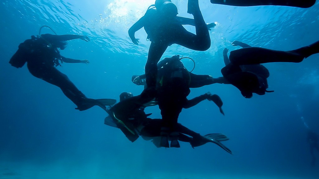Underwater dance, visual arts performance in scuba gear off Cape