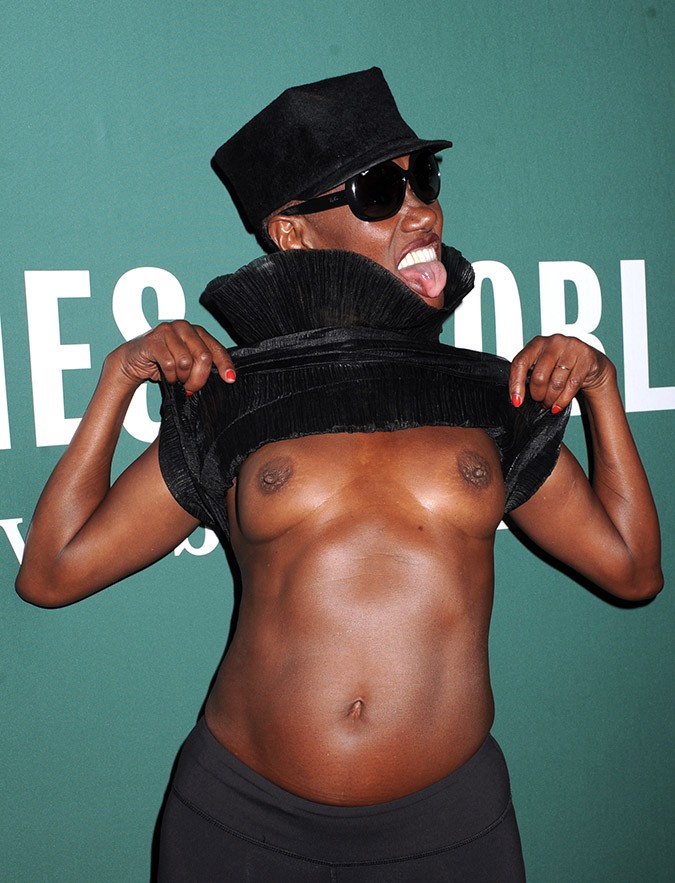 Grace Jones, 67, flashed the cameras with her bare breasts at a book signin...