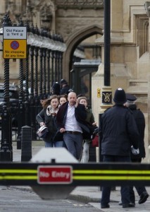 People leave after being evacuated from the Houses of Parliament in central London on March 22, 2017 during an emergency incident. British police shot a suspected attacker outside the Houses of Parliament in London on Wednesday after an officer was stabbed in what police said was a "terrorist" incident. One woman has died and others have "catastrophic" injuries following a suspected terror attack outside the British parliament, local media reported on Wednesday citing a junior doctor. / AFP PHOTO / DANIEL LEAL-OLIVAS