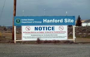 (FILES) This file photo taken on March 17, 2011 shows a sign warning visitors of searches for prohibited materials as they near the Hanford nuclear site in Hanford, Washington.  Hundreds of workers at the nuclear site were ordered to take cover on May 9, 2017, after a tunnel filled with contaminated material collapsed near the facility, federal officials said. Employees at the Hanford Site plant, located about 170 miles (275 kilometers) southeast of downtown Seattle, were sent an alert by management in early morning telling them to "secure ventilation" and refrain from "eating or drinking."  / AFP PHOTO / SHAUN TANDON