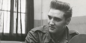 FILE - This is an Oct. 1958 file photo of Associated Press chief of bureau for Germany Richard O'Regan, as he interviews Elvis Presley.   ORegan, who covered some of the biggest stories of the Cold War in a 39-year career as reporter and executive for The Associated Press, has died in a Geneva, Switzerland, hospital, aged 95, it is announced by his son Kevin on Tuesday June 2, 2015.  (AP Photo/FILE)