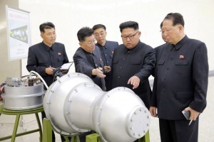 This undated picture released by North Korea's official Korean Central News Agency (KCNA) on September 3, 2017 shows North Korean leader Kim Jong-Un (C) looking at a metal casing with two bulges at an undisclosed location. North Korea has developed a hydrogen bomb which can be loaded into the country's new intercontinental ballistic missile, the official Korean Central News Agency claimed on September 3. Questions remain over whether nuclear-armed Pyongyang has successfully miniaturised its weapons, and whether it has a working H-bomb, but KCNA said that leader Kim Jong-Un had inspected such a device at the Nuclear Weapons Institute. / AFP PHOTO / KCNA VIA KNS / STR / South Korea OUT / REPUBLIC OF KOREA OUT   ---EDITORS NOTE--- RESTRICTED TO EDITORIAL USE - MANDATORY CREDIT "AFP PHOTO/KCNA VIA KNS" - NO MARKETING NO ADVERTISING CAMPAIGNS - DISTRIBUTED AS A SERVICE TO CLIENTS THIS PICTURE WAS MADE AVAILABLE BY A THIRD PARTY. AFP CAN NOT INDEPENDENTLY VERIFY THE AUTHENTICITY, LOCATION, DATE AND CONTENT OF THIS IMAGE. THIS PHOTO IS DISTRIBUTED EXACTLY AS RECEIVED BY AFP.  /