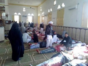 epa06347848 People sit next to bodies of worshippers killed in attack on mosque in the northern city of Arish, Sinai Peninsula, Egypt, 24 November 2017. According to initial reports, dozens were killed and injured in a bombing and gunfire targeting worshipers leaving the Friday prayers in the northern city of Arish.  EPA/STR ATTENTION EDITORS: PICTURE CONTAINS GRAPHIC CONTENT - BEST QUALITY AVAILABLE