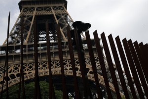 View of a new metal barrier under construction around the Eiffel Tower in Paris, France, Thursday, June 14, 2018. Paris authorities have started replacing the metal security fencing around the Eiffel Tower with a more visually appealing glass wall. The company operating the monument said see-through panels are being set up instead of the fences at the north and south of the famed monument that were installed for the Euro 2016 soccer event. Each panel is 3 meters high, over 6 centimeters thick and weighs 1.5 ton. (AP Photo/Francois Mori)