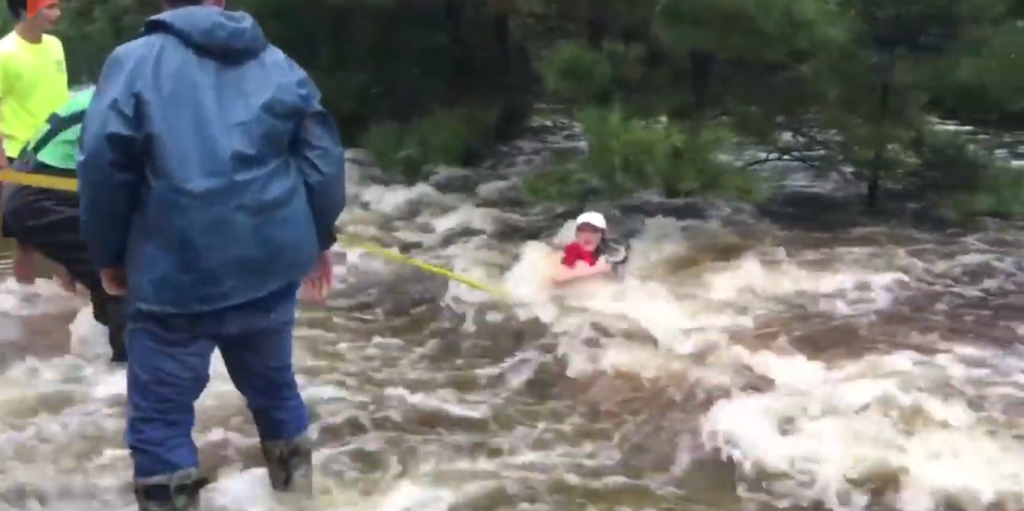 Watch people working together to save a dog before being swept away in ...